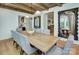 Spacious dining room features wood beams, hardwood floors, large mirrors, and view into living space at 2270 New Gray Rock Rd, Fort Mill, SC 29708