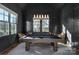 Well-appointed game room with dark walls, pool table, and large windows at 2270 New Gray Rock Rd, Fort Mill, SC 29708