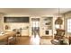 Modern kitchen features stainless steel appliances, white cabinets, and a view into the dining room at 2270 New Gray Rock Rd, Fort Mill, SC 29708