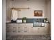 Spacious laundry room with plentiful storage, stainless steel sink, and stylish decor at 2270 New Gray Rock Rd, Fort Mill, SC 29708
