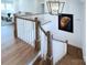 Elegant staircase featuring wooden treads, white balusters, and a stylish modern chandelier at 2270 New Gray Rock Rd, Fort Mill, SC 29708