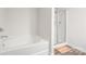 Bathroom featuring a soaking tub and a separate glass-enclosed shower at 2340 Lanza Dr, Charlotte, NC 28215