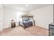 Cozy bedroom with a bunk bed, carpet, and a nightstand at 2340 Lanza Dr, Charlotte, NC 28215