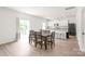 Cozy dining area featuring wood table, bright interiors, and an adjacent modern kitchen at 2340 Lanza Dr, Charlotte, NC 28215