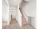 Bright entryway with hardwood floors and staircase leading to the upper level at 2340 Lanza Dr, Charlotte, NC 28215