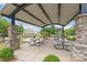 Shaded picnic area with stone pillars and well-maintained landscaping for outdoor gatherings at 2340 Lanza Dr, Charlotte, NC 28215