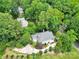 Aerial view of home surrounded by lush trees and landscaping at 267 Ikerd Se Dr, Concord, NC 28025