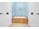 Elegant bathroom with a luxurious tub and neutral tiles at 267 Ikerd Se Dr, Concord, NC 28025