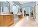 Primary bath with dual sinks, and walk-in closet access at 267 Ikerd Se Dr, Concord, NC 28025