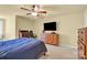 Comfortable bedroom with carpet, warm color palette, and a built-in desk at 267 Ikerd Se Dr, Concord, NC 28025