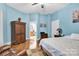 Bright bedroom with hardwood floors, en suite bathroom, and a comfortable bed at 267 Ikerd Se Dr, Concord, NC 28025