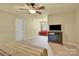 Bright bedroom with a ceiling fan, tan carpet and neutral walls at 267 Ikerd Se Dr, Concord, NC 28025