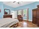 Serene bedroom with hardwood floors, natural light, and classic furnishings at 267 Ikerd Se Dr, Concord, NC 28025