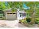 View of the house with its garage, driveway, and cozy porch at 267 Ikerd Se Dr, Concord, NC 28025