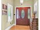 Elegant foyer showcasing a wooden front door with decorative glass, complemented by sidelights at 267 Ikerd Se Dr, Concord, NC 28025