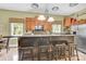 Functional kitchen island with barstool seating and stainless steel appliances offer a cozy and inviting space at 267 Ikerd Se Dr, Concord, NC 28025