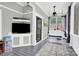 Cozy screened porch area with a swing and mounted television for outdoor entertainment at 267 Ikerd Se Dr, Concord, NC 28025