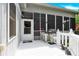 A screened porch with a grill and door at 267 Ikerd Se Dr, Concord, NC 28025