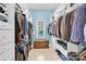 Organized walk-in closet with ample storage space and a window for natural light at 267 Ikerd Se Dr, Concord, NC 28025