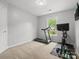 Exercise room with treadmill, weights, and a mounted television at 2821 Providence Spring Ln, Charlotte, NC 28270