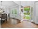 Elegant foyer featuring hardwood floors, wainscoting, and a view to the front yard at 2821 Providence Spring Ln, Charlotte, NC 28270