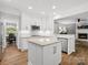 Bright kitchen featuring a large island, stainless steel appliances, and open layout at 2821 Providence Spring Ln, Charlotte, NC 28270