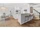 Open kitchen featuring granite counters, stainless steel appliances, and a breakfast bar with seating at 2821 Providence Spring Ln, Charlotte, NC 28270