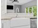 Modern farmhouse sink, elegant faucet, granite countertops, and stainless steel dishwasher in the kitchen at 2821 Providence Spring Ln, Charlotte, NC 28270