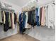 Walk-in closet with visible wire shelving and an assortment of clothes and boxes at 2821 Providence Spring Ln, Charlotte, NC 28270