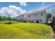 Expansive backyard featuring lush green grass and a black fence, perfect for outdoor activities and privacy at 3471 Melwood Estates Dr, Denver, NC 28037