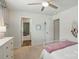 Bright bedroom with a ceiling fan, white trim, and cozy decor, creating a comfortable space at 3471 Melwood Estates Dr, Denver, NC 28037