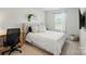 Serene bedroom with a desk, a plush bed, and soft natural light offering a calming retreat at 3471 Melwood Estates Dr, Denver, NC 28037