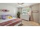 Inviting bedroom featuring bright natural light, colorful accents, and a cozy rug at 3471 Melwood Estates Dr, Denver, NC 28037