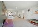 Expansive bonus room with playful decor, storage, and natural light for Gathering fun and games at 3471 Melwood Estates Dr, Denver, NC 28037