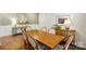 Dining room with wood table, six chairs, decor, and hardwood floors at 3471 Melwood Estates Dr, Denver, NC 28037
