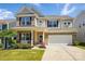 Charming brick and siding home with a two-car garage and manicured lawn at 3471 Melwood Estates Dr, Denver, NC 28037