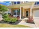 Cozy front porch featuring brick accents, seating and well maintained landscaping at 3471 Melwood Estates Dr, Denver, NC 28037