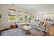 Spacious living room with a sectional sofa, area rug, and multiple windows providing natural light at 3471 Melwood Estates Dr, Denver, NC 28037