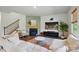 Inviting living room with a fireplace, comfortable seating, and access to the upper level stairs at 3471 Melwood Estates Dr, Denver, NC 28037