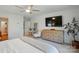 Sunlit main bedroom showcases a king bed, a dresser, a ceiling fan and a cozy decor at 3471 Melwood Estates Dr, Denver, NC 28037