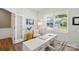 Bright home office featuring french doors, large windows, and modern decor at 3471 Melwood Estates Dr, Denver, NC 28037