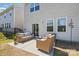 Outdoor patio featuring comfortable seating, overlooking the backyard and neighborhood homes at 3471 Melwood Estates Dr, Denver, NC 28037