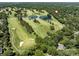 Gorgeous aerial view of golf course with ponds, near houses with lush trees in a neighborhood at 3531 Bon Rea Dr, Charlotte, NC 28226