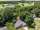 Aerial view of a modern home nestled near a lush golf course, surrounded by mature trees and well-maintained landscaping at 3531 Bon Rea Dr, Charlotte, NC 28226