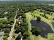 Beautiful aerial view of the home near a golf course and ponds, surrounded by lush trees and green landscape at 3531 Bon Rea Dr, Charlotte, NC 28226