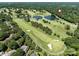 Wide aerial view of golf course with ponds and lush tree canopy in an upscale neighborhood at 3531 Bon Rea Dr, Charlotte, NC 28226