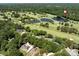 Beautiful aerial shot of residential homes near a golf course with lush trees, ponds, and greens at 3531 Bon Rea Dr, Charlotte, NC 28226
