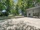 A wooden deck overlooks the spacious landscaped backyard of this tree filled property at 3531 Bon Rea Dr, Charlotte, NC 28226
