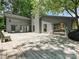 Spacious wooden deck with a modern, gray house in a tree-filled, landscaped backyard at 3531 Bon Rea Dr, Charlotte, NC 28226