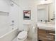 Bathroom featuring a tub, white subway tile, and a modern vanity with neutral tones at 3531 Bon Rea Dr, Charlotte, NC 28226